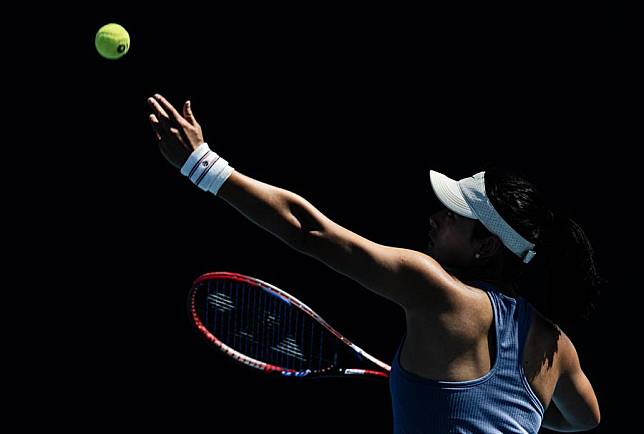 Wang Yafan serves during the women's singles first round match against Anna Bondar of Hungary at the Australian Open tennis tournament in Melbourne, Australia, Jan. 14, 2025. (Photo by Hu Jingchen/Xinhua)