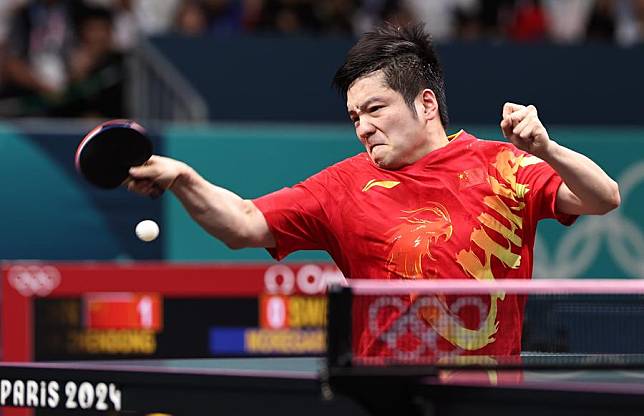 Fan Zhendong of China returns the ball during the men's team gold medal match at the 2024 Olympic Games in Paris, France, on Aug. 9, 2024. (Xinhua/Wang Dongzhen)