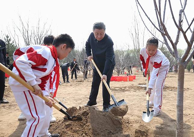 Chinese President Xi Jinping, also general secretary of the Communist Party of China Central Committee and chairman of the Central Military Commission, plants a tree during a voluntary tree planting activity in a forest park in Tongzhou District in Beijing, capital of China, April 3, 2024. (Xinhua/Ju Peng)