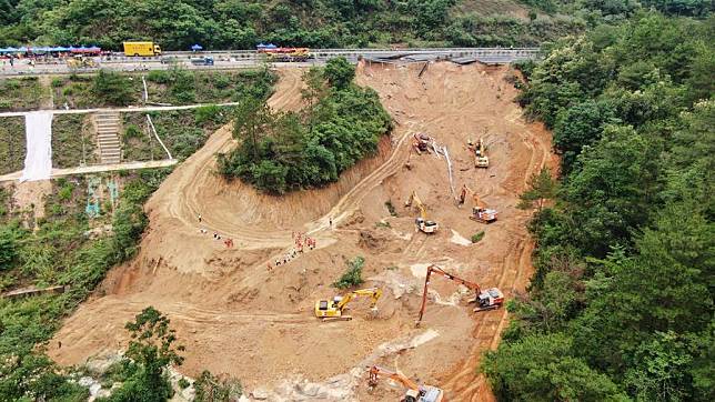 An aerial drone photo taken on May 2, 2024 shows rescuers and excavators working at the site of an expressway collapse on the Meizhou-Dabu Expressway in Meizhou, south China's Guangdong Province. (Xinhua/Wang Ruiping)