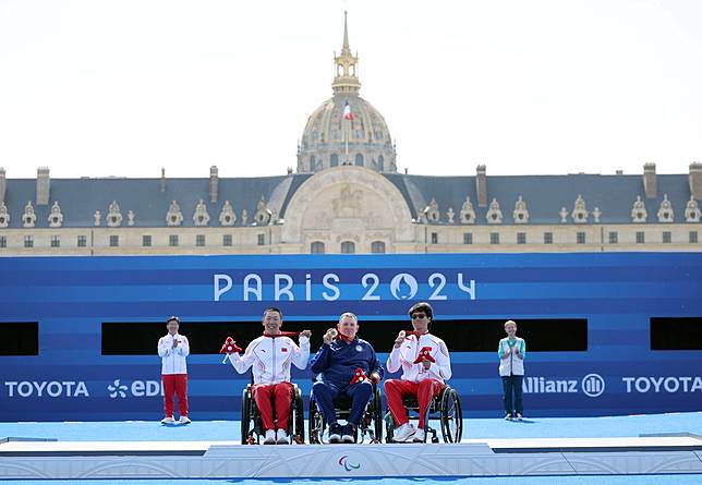 Silver medalist Han Guifei of China, gold medalist Jason Tabansky of the United States and bronze medalist Zhang Tianxin of China (L to R) pose during the awarding ceremony for the para archery men's individual W1 event at the Paris 2024 Paralympic Games in Paris, France, Sept. 1, 2024. (Xinhua/Hou Jun)