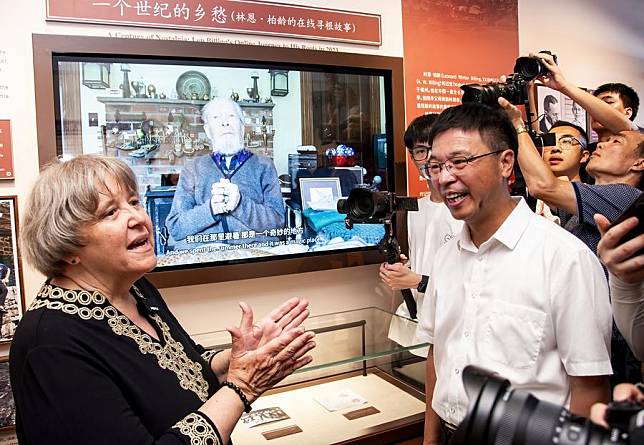 Elyn MacInnis (1st L), an adviser to the Kuliang tourism and culture research association, tells story of Leonard Billing at Kuliang Families Story Museum in Kuliang, Fuzhou, southeast China's Fujian Province, June 22, 2024. (Xinhua/Wei Peiquan)