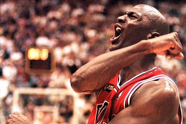 Michael Jordan of the Chicago Bulls celebrates after winning game six of the 1998 NBA Finals against the Utah Jazz. Photo: AFP