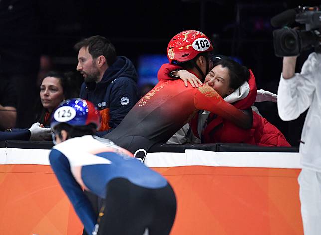 Sun Long © of China hugs coach Zhang Jing after the men's 1500m final A at the ISU World Short Track Speed Skating Championships 2024 in Rotterdam, the Netherlands, March 16, 2024. (Xinhua/Lian Yi)