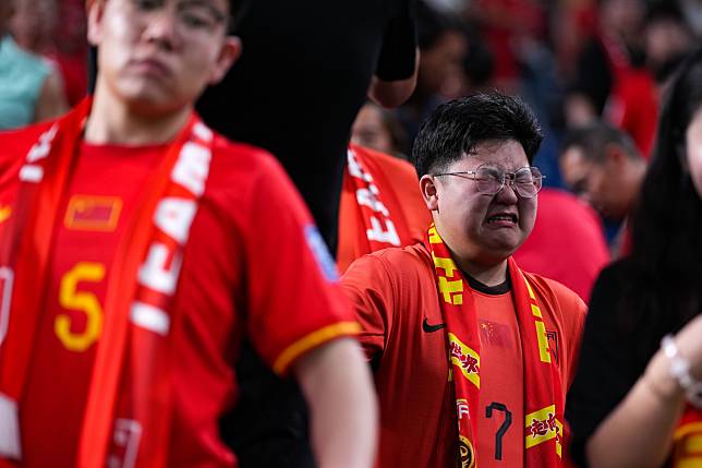 A fan of China reacts after the 2026 FIFA World Cup Asian qualifier between China and Japan in Saitama, Japan, Sept. 5, 2024. (Xinhua/Zhang Xiaoyu)