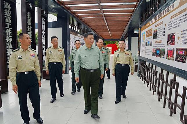 Chinese President Xi Jinping, also general secretary of the Communist Party of China Central Committee and chairman of the Central Military Commission, learns about the history of a brigade, on Oct. 17, 2024. Xi inspected a brigade of the Chinese People's Liberation Army Rocket Force on Thursday. (Xinhua/Li Gang)