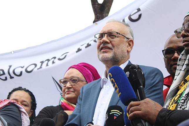 Expelled South African ambassador to the United States Ebrahim Rasool speaks to a crowd at Cape Town International Airport in Cape Town, South Africa, on March 23, 2025. (Photo by Shakirah Thebus/Xinhua)
