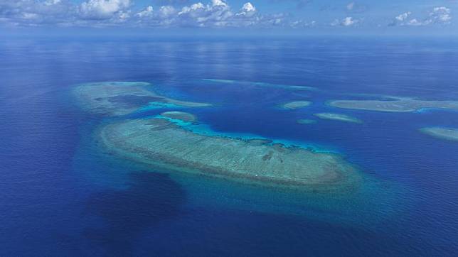 This photo carried in a report named &ldquo;A Survey Report on the Coral Reef Ecosystem of Xianbin Jiao&rdquo; shows an aerial view of Xianbin Jiao of China's Nansha Qundao. (Xinhua)