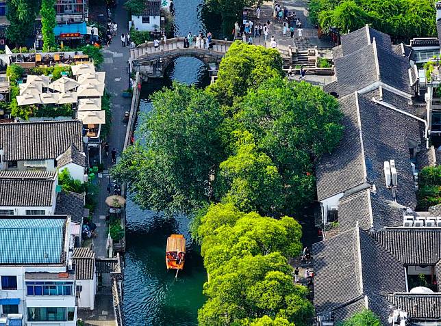 This aerial photo taken on July 3, 2023 shows a view of a historic and cultural block of Pingjiang Road in Suzhou, east China's Jiangsu Province. (Xinhua/Li Bo)