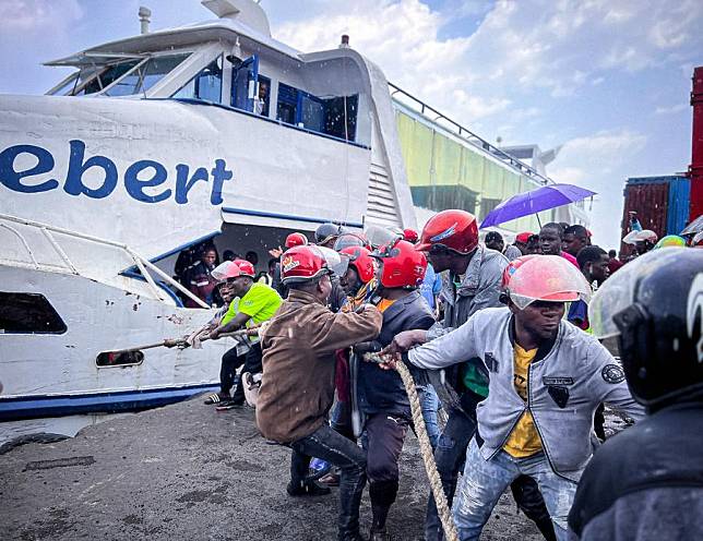 Workers pull a ferry to the wharf at a dock in Goma, the Democratic Republic of the Congo (DRC), Feb. 18, 2025. (Photo by Zanem Nety Zaidi/Xinhua)