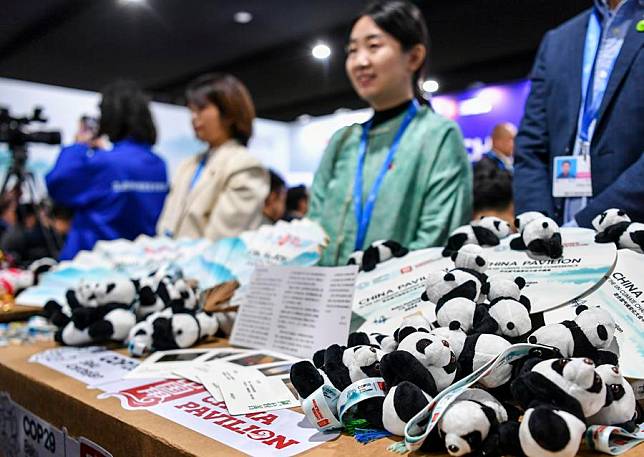 This photo taken on Nov. 13, 2024 shows products displayed at the China Pavilion during the 29th session of the Conference of the Parties to the United Nations Framework Convention on Climate Change (COP29) in Baku, Azerbaijan. Various products and services with Chinese elements have drawn attention from participants at COP29. (Xinhua/Cao Yang)