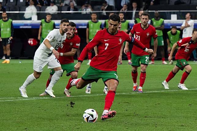 Cristiano Ronaldo (front) of Portugal takes a penalty kick during the UEFA Euro 2024 round of 16 match against Slovenia in Frankfurt, Germany on July 1, 2024. (Xinhua/Xiao Yijiu)
