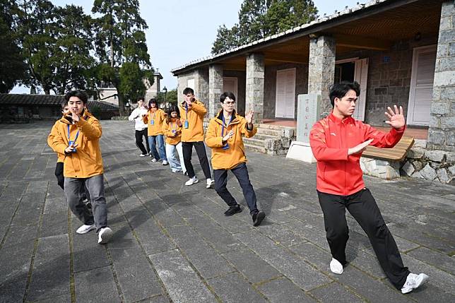 Participants of a Chinese martial arts cultural exchange event stage a Chinese martial arts performance at Kuliang Club, a historical public service community, in Kuliang, Fuzhou, southeast China's Fujian Province, Dec. 27, 2024. (Xinhua/Lin Shanchuan)