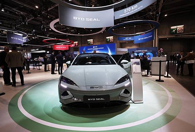 People visit the pavilion of Chinese carmaker BYD at the 2024 Paris Motor Show during the media day in Paris, France, Oct. 14, 2024. (Xinhua/Gao Jing)