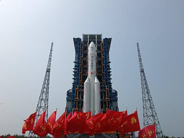 This photo taken on April 27, 2024 shows the combination of the Chang'e-6 lunar probe and the Long March-5 Y8 carrier rocket having been transferred vertically to the launching area at the Wenchang Space Launch Center in south China's Hainan Province. (Photo by Huang Guochang/Xinhua)