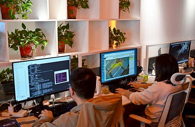Staff members develop industrial software at a software company in Tianjin, north China, April 18, 2025. (Xinhua/Sun Fanyue)