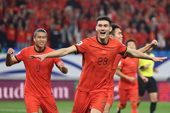 Baihelamu Abuduwaili (front) of China celebrates his goal during the 2026 FIFA World Cup Asian Qualifiers Group C match against Indonesia in Qingdao, east China's Shandong Province, Oct. 15, 2024. (Xinhua/Jia Haocheng)