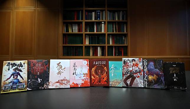 This photo taken on Nov. 21, 2024 shows some hard copies of online Chinese novels during their inclusion event at the British Library in London, Britain. (Xinhua/Li Ying)