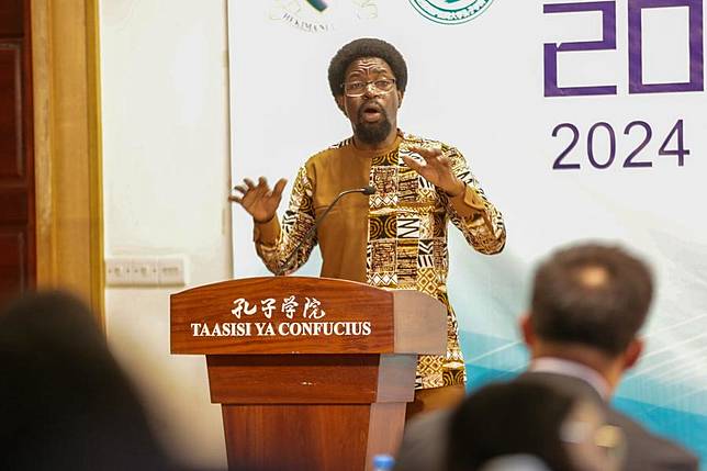 Aldin Mutembei, the Tanzanian director of the Confucius Institute at the University of Dar es Salaam, delivers a speech at the opening ceremony of a workshop at the Confucius Institute at the University of Dar es Salaam in Tanzania, Dec. 14, 2024. (Xinhua/Emmanuel Herman)