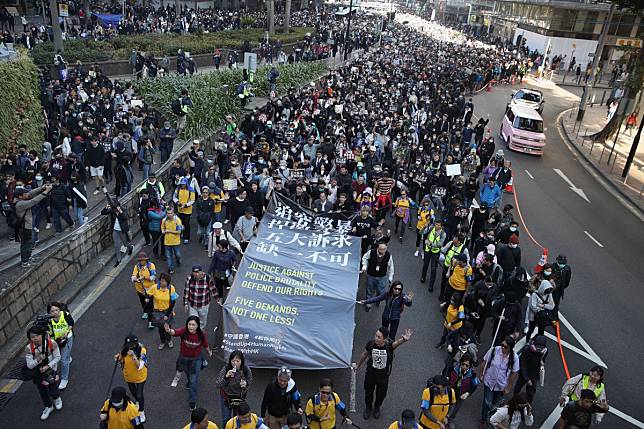 Anti-government protesters march from Causeway Bay to Central on Sunday, the eve of the six-month anniversary of Hong Kong’s political crisis. Photo: Winson Wong