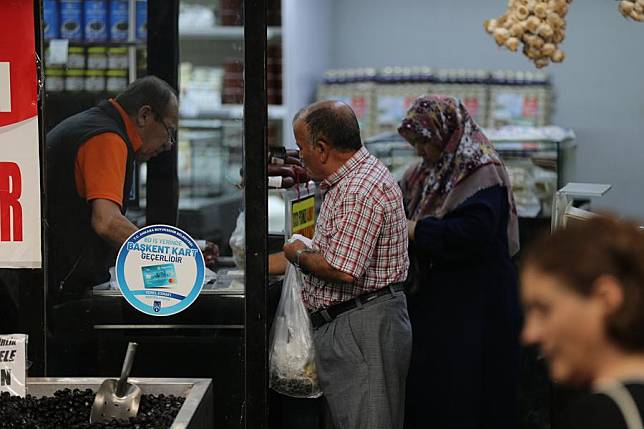 People shop at a market in Ankara, Türkiye, on Oct. 3, 2024. (Mustafa Kaya/Handout via Xinhua)