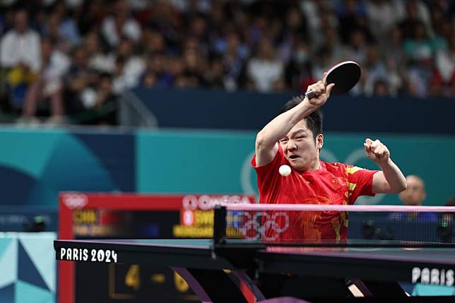 Fan Zhendong returns a shot during the men's table tennis team gold medal match at the 2024 Olympic Games in Paris, France, on Aug. 9, 2024. (Xinhua/Wang Dongzhen)