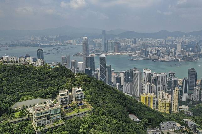 An aerial view of residential buildings on The Peak. Luxury home prices in Hong Kong are expected to remain flat next year. Photo: Roy Issa