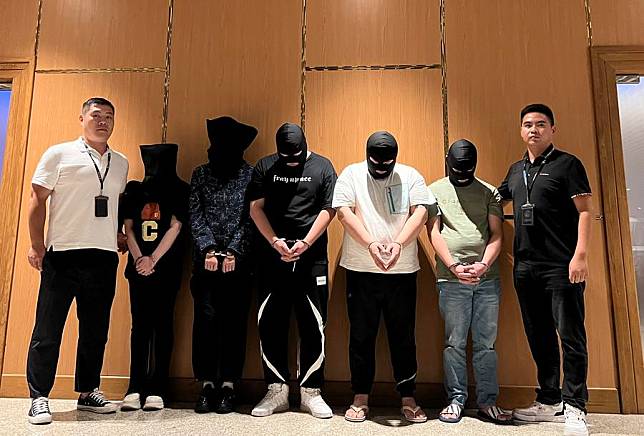 Myanmar police hand over five telecom and internet fraud suspects to Chinese police at Yangon International Airport in Yangon, Myanmar, Aug. 26, 2023. (Chinese embassy in Myanmar/Handout via Xinhua)