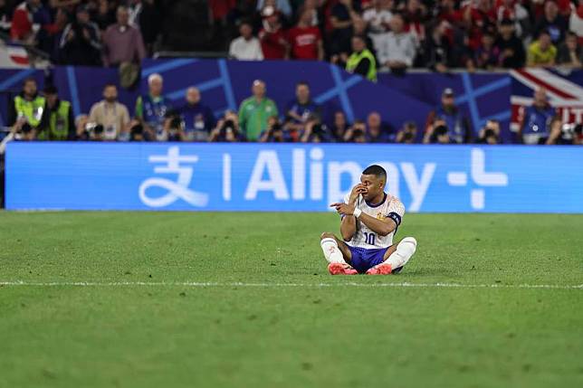 Kylian Mbappe of France reacts after being injured during the UEFA Euro 2024 Group D match against Austria in Dusseldorf, Germany, on June 17, 2024. (Xinhua/Pan Yulong)