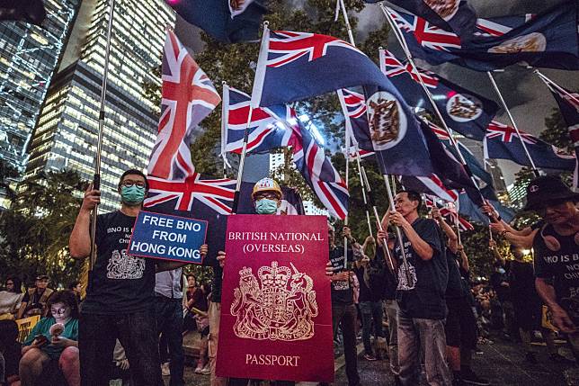 Colonial Hong Kong flags fly in Central on Friday night. Photo: Winson Wong