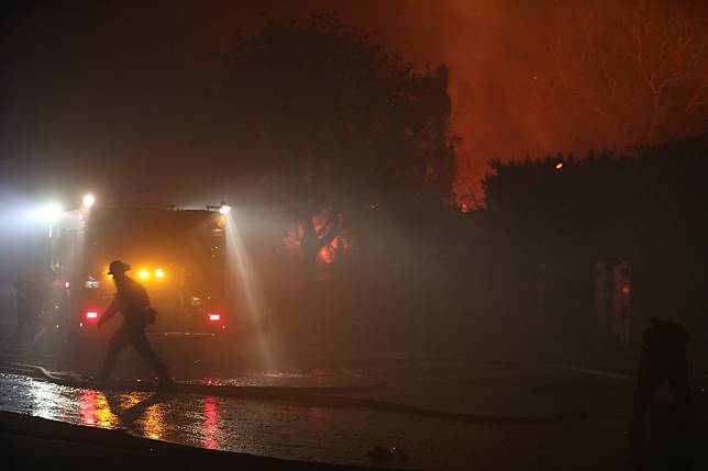 A firefighter battles the Palisades fire in Pacific Palisades, Los Angeles County, California, the United States, on Jan. 7, 2025. (Photo by Qiu Chen/Xinhua)