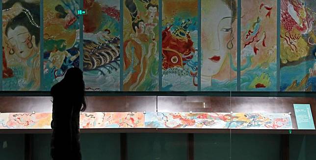 A visitor watches an exhibition of the Eight Great Masters of the Tang (618-907) and the Song (960-1279) Dynasties in the Liaoning Provincial Museum in Shenyang, northeast China's Liaoning Province, Dec. 4, 2020. (Xinhua/Yao Jianfeng)