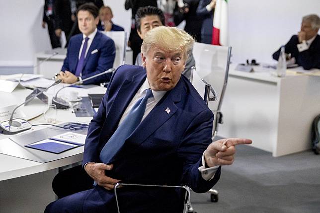 US President Donald Trump attends a session at the G7 summit in Biarritz on Sunday. He told media: “We’re getting along very well with China right now. We’re talking.” Photo: AP