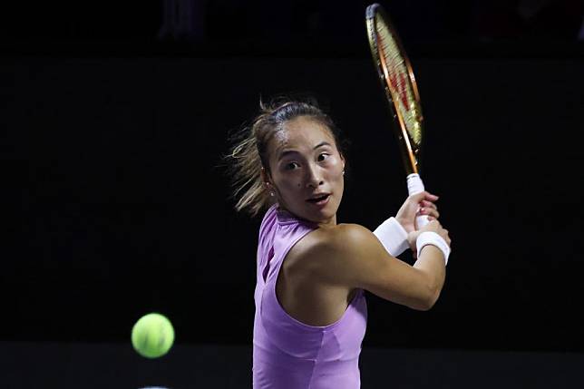 Zheng Qinwen hits a return during the final of the 2024 WTA Finals against Coco Gauff in Riyadh, Saudi Arabia, Nov. 9, 2024. (Xinhua/Wang Haizhou)