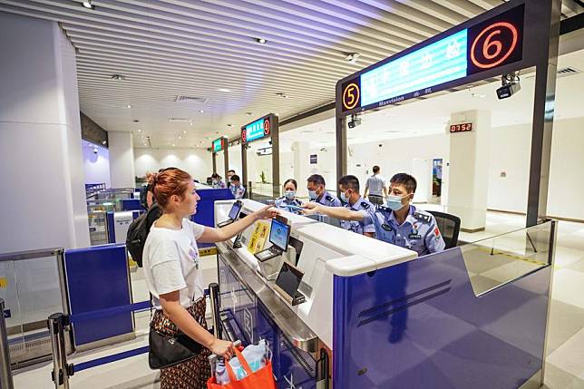 An inbound passenger goes through border control at Sanya Phoenix International Airport in Sanya, south China's Hainan Province, May 1, 2024. (Photo by Meng Xushun/Xinhua)