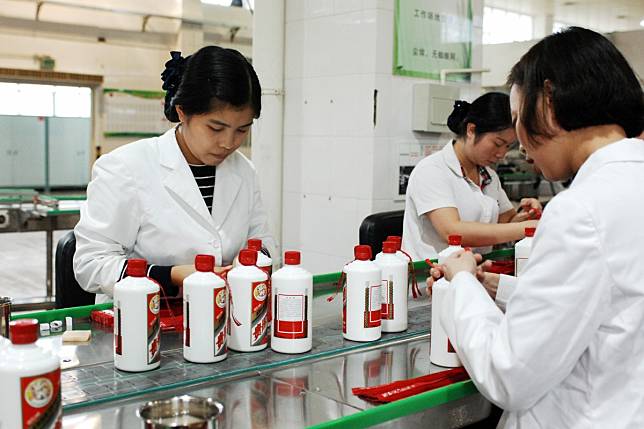 Workers pack bottles of Kweichow Moutai liquor in Renhuai, in the southwest Chinese province of Guizhou. Photo: Xinhua