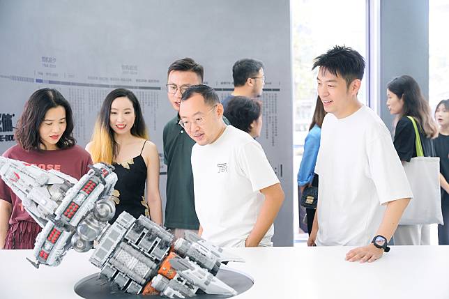 People look at a spaceship model in the Three-Body Four-Dimensional Space, the world's first offline experience facility recreating the Three-Body universe, in Chengdu, capital of southwest China's Sichuan Province, Sept. 22, 2024. (Three-Body Universe (Shanghai) Cultural Development Co., Ltd.)/Handout via Xinhua)