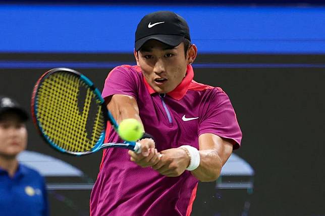 Chinese player Shang Juncheng hits a return during the final against Lorenzo Musetti of Italy at the ATP Chengdu Open held in Chengdu, Sichuan Province of China, on Sept. 24, 2024. (Organizing Committee/Handout via Xinhua)