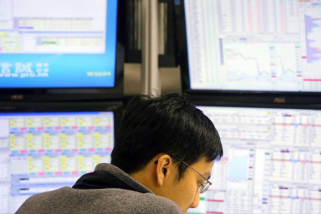 A stock broker monitoring prices at the Prudential Brokerage in Central, pictured in 2016. Photo: Dickson Lee