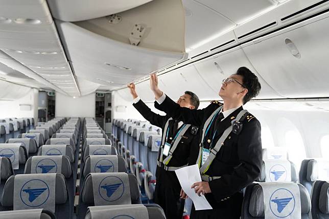 Customs officers of Meilan International Airport examine an inbound airplane at the one-stop aircraft maintenance base of Hainan Free Trade Port in Haikou, south China's Hainan Province, Jan. 16, 2025. (Xinhua/Zhang Liyun)