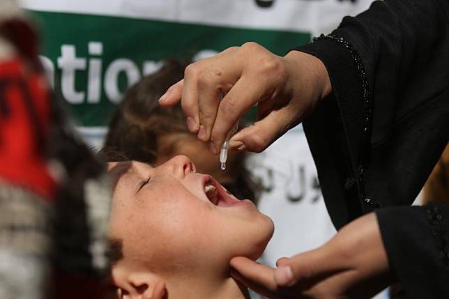 A child is given a dose of anti-polio vaccine in Kabul, Afghanistan, Oct. 29, 2024. (Photo by Saifurahman Safi/Xinhua)