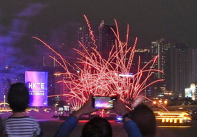 People watch a firework show at the Victoria Harbor in Hong Kong, south China, May 1, 2024. (Xinhua/Chen Duo)