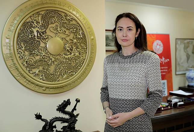 Gulnar Shaimergenova, director of the China Studies Center in Kazakhstan, poses for photo at her office in Kazakhstan, Feb. 29, 2020.