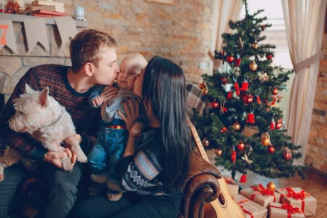 family-sitting-sofa-with-dog-christmas.jpg