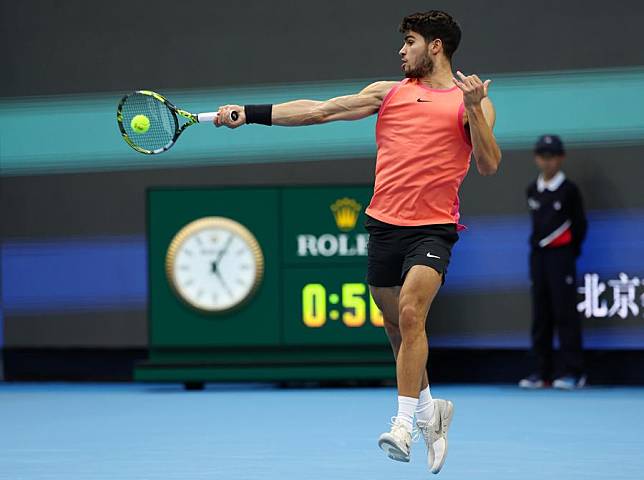 Carlos Alcaraz of Spain hits a return during the men's singles quarterfinals against Karen Khachanov of Russia at 2024 China Open tennis tournament in Beijing, capital of China, Sept. 30, 2024. (Xinhua/Zhang Chenlin)