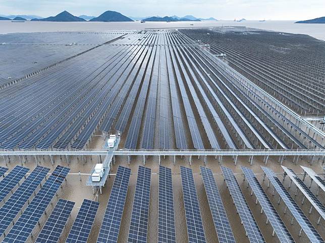 An aerial drone photo taken on March 26, 2024 shows a photovoltaic power project in Sanmen County of Taizhou City, east China's Zhejiang Province. (Xinhua/Weng Xinyang)