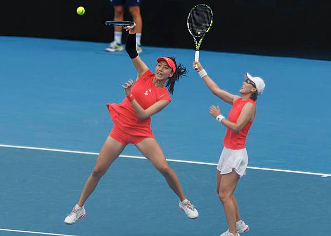 Wang Xinyu (L) and Zheng Saisai in action during their Australian Open women's doubles third round defeat to Kamilla Rakhimova and Sara Sorribes Tormo in Melbourne, Jan. 20, 2025. (Photo by Chu Chen/Xinhua)