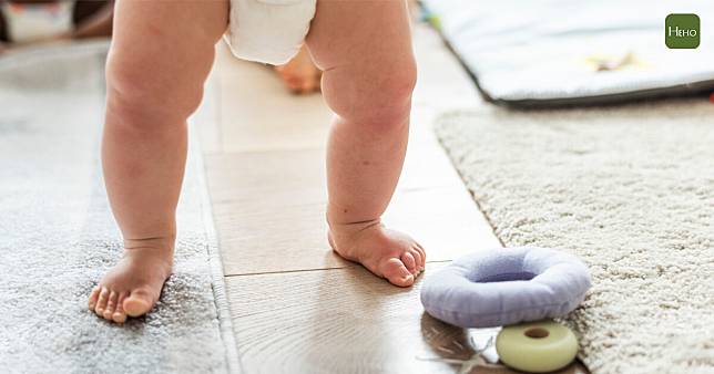 Closeup of baby's legs while standing