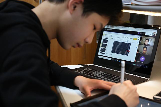 Hong Kong student Alex Leung Man-fung attends an online class from home amidst the coronavirus outbreak. Photo: K. Y. Cheng
