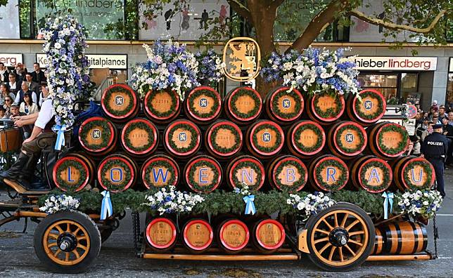 A wagon of a local beer brand takes part in a parade during the official opening of the Oktoberfest in Munich, Germany, Sept. 21, 2024. (Xinhua/Ren Pengfei)